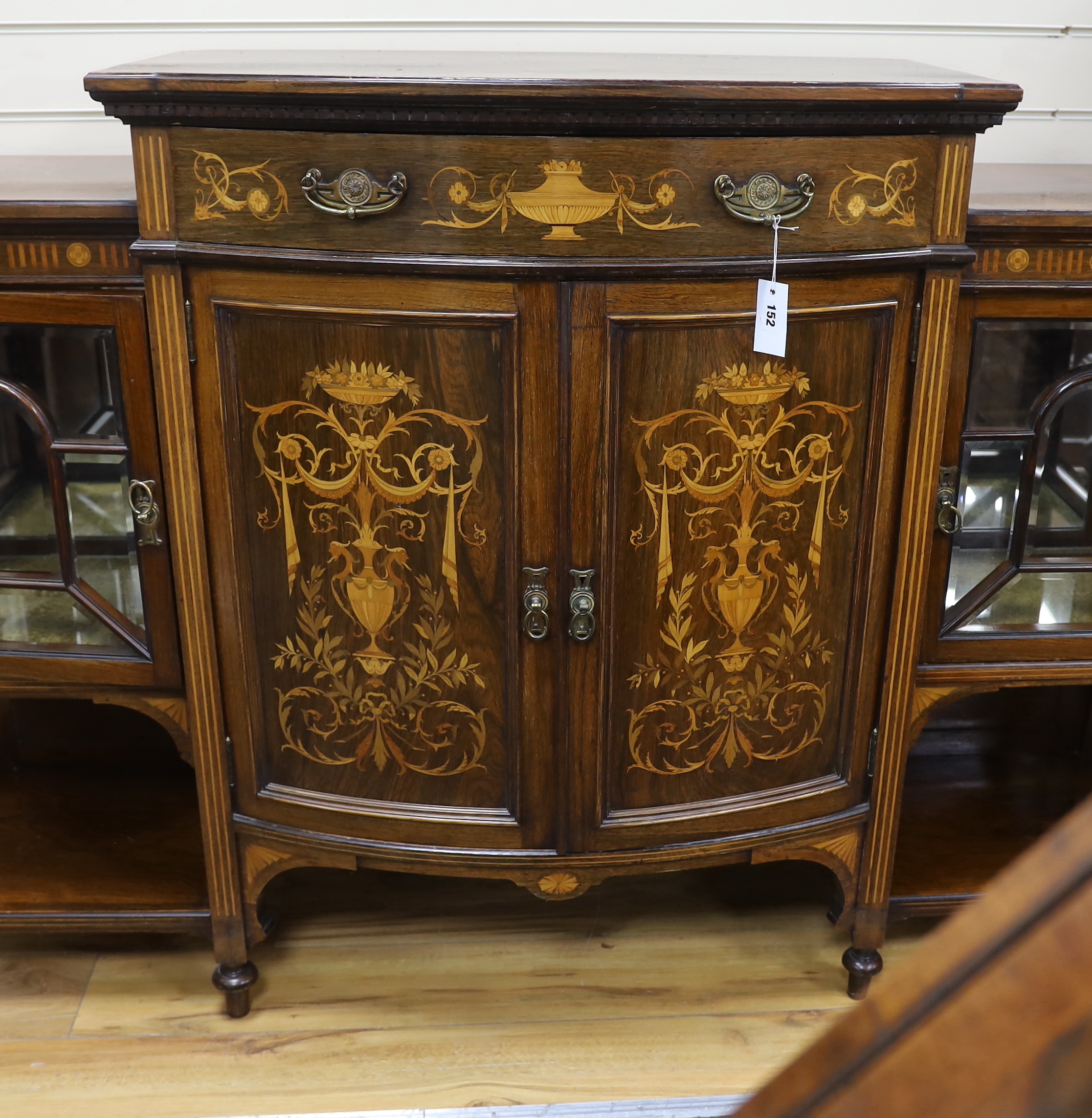 A late Victorian marquetry inlaid rosewood bow front side cabinet, width 168cm, depth 48cm, height 111cm